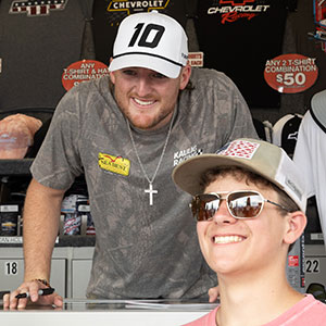 A fan takes a photo with Ty DIllon