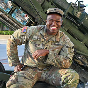 A man in the military poses for the camera
