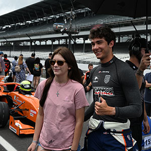 A fan poses with a SVRA Driver